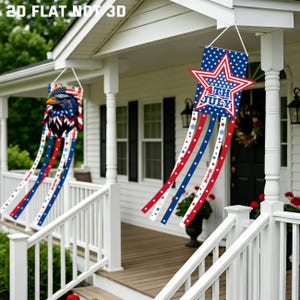 May include: Two patriotic windsock banners hanging on a porch. One features an American eagle design, the other a star with "4th of July" text. Both have red, white, and blue streamers, perfect for Independence Day.