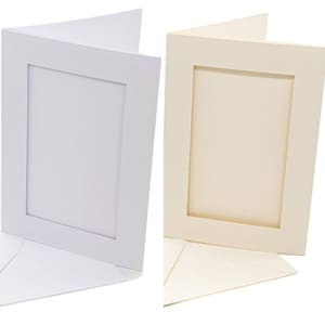 May include: Two folded greeting cards with matching envelopes, one in bright white and one in cream. Each card features a rectangular embossed frame border on the front cover, creating a clean, textured surface for custom messages or photos.