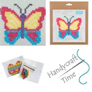 May include: A cross stitch kit featuring a colorful butterfly design. The kit includes a pre-printed fabric, embroidery floss, and a needle. Learn to cross stitch with this easy-to-follow kit.