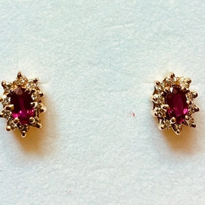 Ruby and Diamond earrings in 14K yellow gold setting.