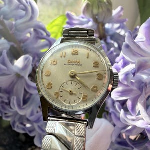 Vintage Doxa dameshorloge, Zwitsers gemaakt, handmatig opwindbaar, jaren 60, kleine zilveren wijzerplaat met subseconde-functie, klassiek retro, zeldzaam verzamelobject.