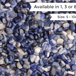May include: A close-up of a pile of blue and white tumbled stones. The stones are various sizes and shapes, ranging from 5 to 10 millimeters. Available in 1, 3, or 8 ounces.