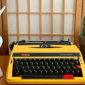 Vintage Yellow Brother Deluxe 660TR Typewriter Nagoya Japan Mid Century with Hard Plastic Case