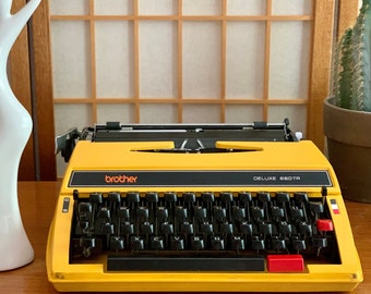 Vintage Yellow Brother Deluxe 660TR Typewriter Nagoya Japan Mid Century with Hard Plastic Case