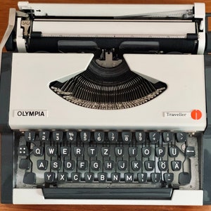 Olympia Traveller Typewriter white, Midcentury 70s, fully functional, German letters, vintage mechanical portable type machine with case