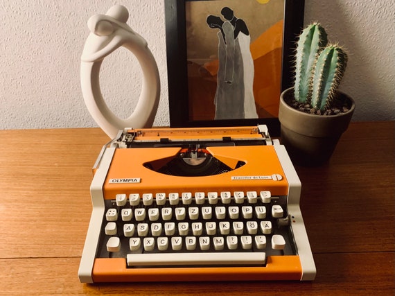 Olympia Traveller De Luxe Typewriter Orange White