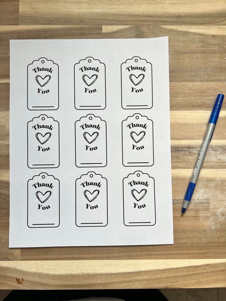 May include: Nine printable gift tags with a black and white design. Each tag features a heart with the text "Thank You".