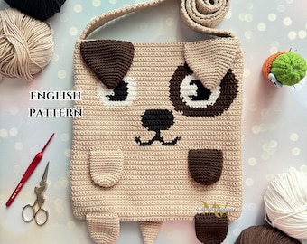 May include: Crocheted dog-shaped shoulder bag with brown, beige, black, and white yarn. The bag has a strap and a cute dog face with eyes, nose, and ears.