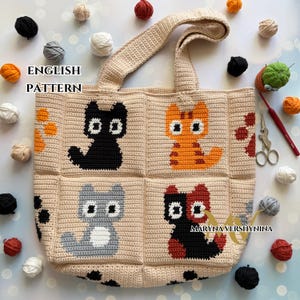 May include: A beige crochet tote bag featuring four cat designs in black, orange, gray, and black/red. The bag has a matching handle and is surrounded by yarn balls in various colors. The text "ENGLISH PATTERN" is visible.