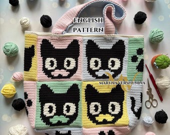 May include: A handmade crochet tote bag featuring a repeating pattern of black cat faces on a patchwork design. The bag is in pastel colors with the text "ENGLISH PATTERN". Yarn balls and crochet tools are scattered around the bag.
