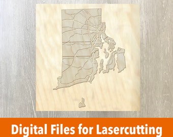 May include: A laser-cut wooden map of the state of Rhode Island. The map shows the state's major roads and waterways. The map is on a light brown wooden background.