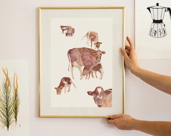 May include: A watercolor painting of a brown cow and her calf. The painting is framed in a gold frame and is hanging on a white wall.