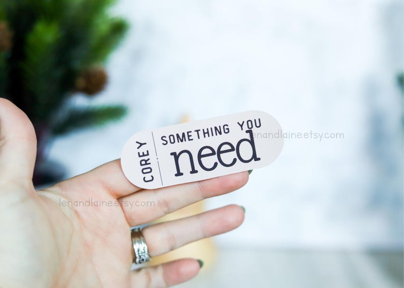 May include: White sticker with black text that reads "Corey Something You Need" and a website address.