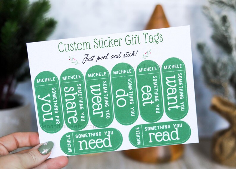 May include: Green sticker gift tags with the text "Custom Sticker Gift Tags" and "Just peel and stick!"  The tags are labeled with the name "Michele" and have different phrases like "Something you need", "Something you want", "Something you share", "Something you wear", "Something you do", "Something you eat", and "Something you read".