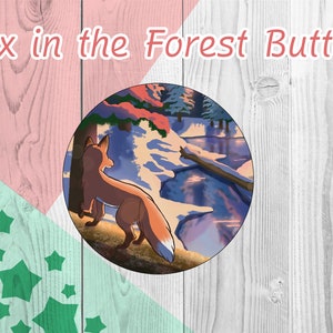 May include: A round button with a fox standing in a snowy forest scene. The fox is brown and orange with a white tail tip. The forest is covered in snow and there is a frozen lake in the background. The button is surrounded by a white wooden background.