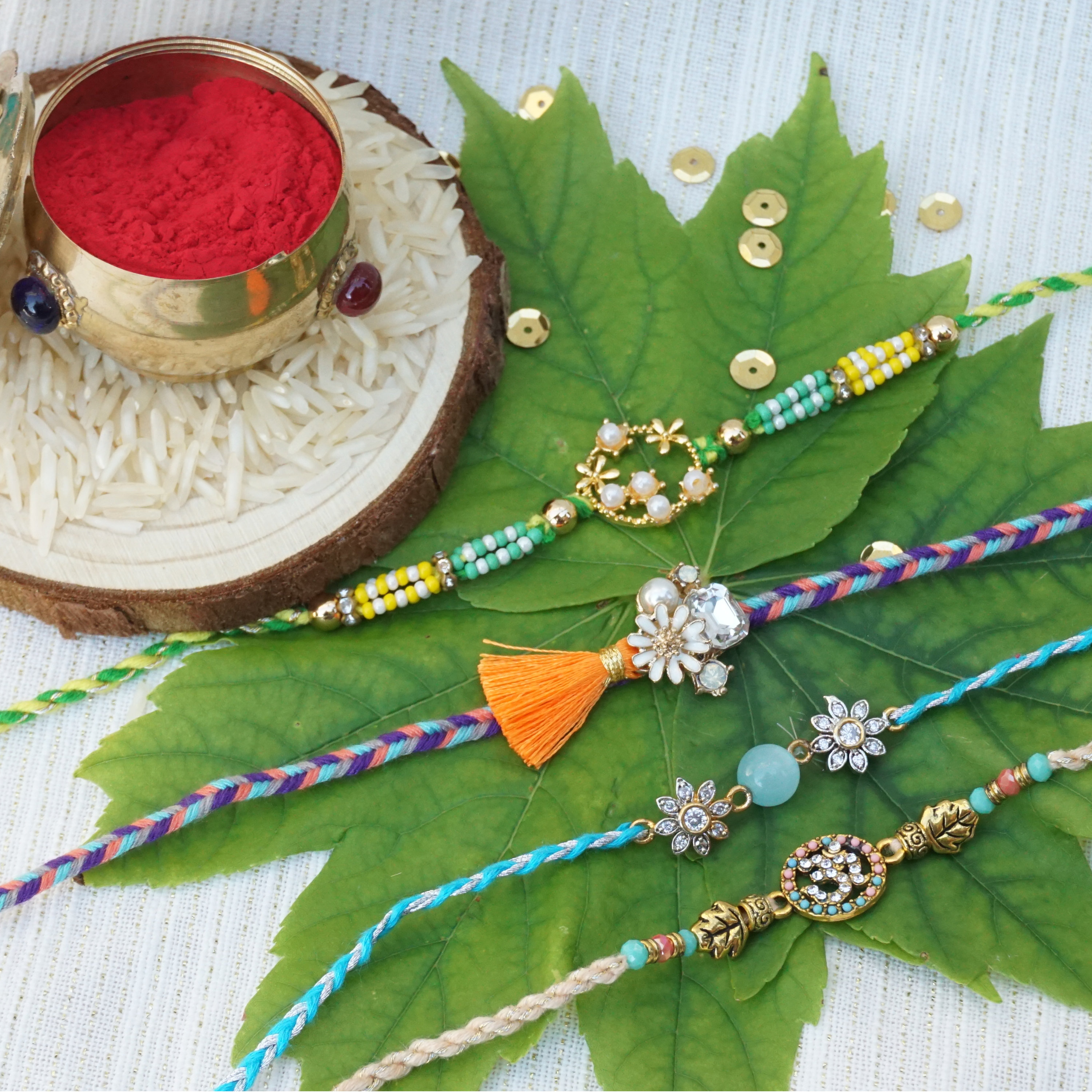 UtsaWe Rakhi | Unique colorful RAKHI W/ Beautiful Beads and Diamonds + Roli, Chaval, Chandan & Cube Sugar | Rakhi set | Designer Rakhi
