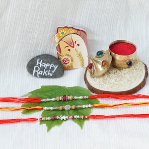 UtsaWe Rakhi | Cute Silver RAKHI W/ Beautiful Beads + Roli, Chaval, Chandan & Cube Sugar | Rakhi set | Designer Rakhi