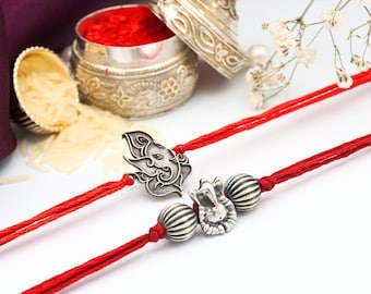 UtsaWe Rakhi | Ganesha Silver RAKHI + Roli, Chaval | Rakhi set | Designer Rakhi | Devotional Rakhi | Oxidized Silver Rakhi | Divine Rakhri