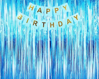 May include: Blue and silver foil fringe curtain with a banner that reads "Happy Birthday" in gold letters.