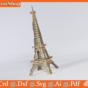 Puede incluir: Un modelo de madera de la Torre Eiffel, un famoso monumento de Par&iacute;s, Francia. El modelo est&aacute; hecho de madera cortada con l&aacute;ser y se ensambla para crear una r&eacute;plica detallada de la torre. El modelo es de color marr&oacute;n claro y tiene detalles negros.
