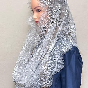 Vintage-inspired French lace infinity chapel mantilla veil, perfect for Mass. Elegant, timeless design crafted from delicate floral lace.