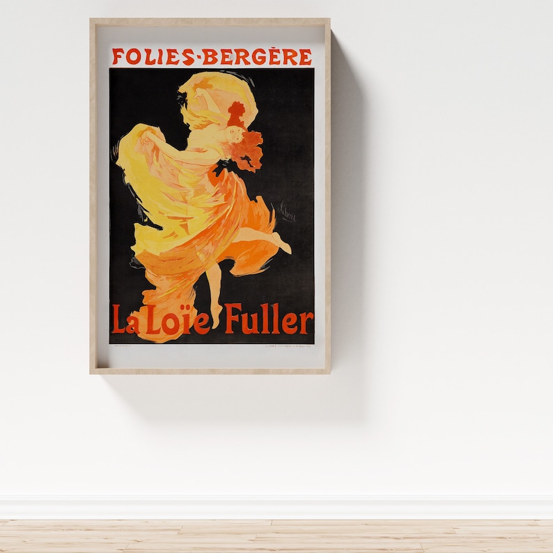 May include: A vintage poster advertising a performance by La Loie Fuller at the Folies-Berg&egrave;re. The poster features a woman in a flowing yellow and orange dress, dancing on a black background.