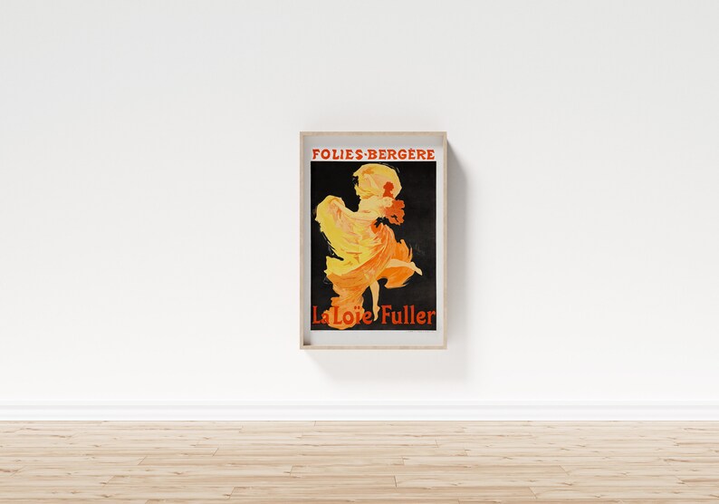 May include: A vintage poster advertising a performance by La Loie Fuller at the Folies-Berg&egrave;re. The poster features a black background with a silhouette of a woman in a flowing yellow and orange dress, dancing on stage.