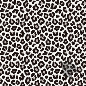 May include: A repeating textile pattern featuring a classic leopard print design. The surface displays irregular black spots and soft grey patches set against a clean white background, creating a high-contrast animal skin motif across the fabric.