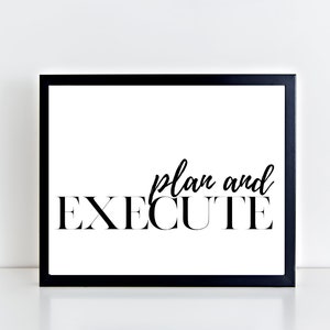 May include: Black and white framed print with the text "plan and EXECUTE" in a modern font.