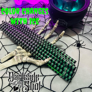 May include: A set of black and green striped drinking straws with a color-changing cauldron in the background. The text "Color Changes With Ice" is written in white letters on a black background. The text "Darkside of My Soul" is written in black letters on a white background.