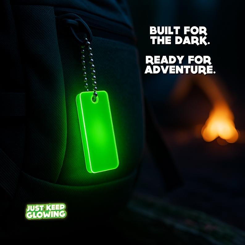 Glow in the dark keychain on camping backpack – rugged outdoor survival gear ready for adventure.