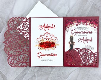 May include: Burgundy red laser cut invitation with a white inner card. The inner card features a red crown with red roses and gold accents. The text on the card reads "Aaliyah's Quinceañera April 17th, 2025". The outer card features a burgundy red laser cut design with a silhouette of a woman in a black dress. The text on the outer card reads "MR. & MRS. FRANCO CORDIALLY INVITE YOU TO CELEBRATE THE QUINCEAÑERA OF THEIR DAUGHTER Aaliyah Saturday APRIL 17TH, 2025".