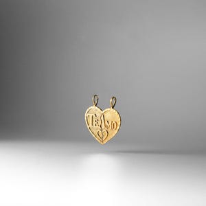 May include: Gold heart-shaped pendant necklace with the words "Te Amo" engraved on it.