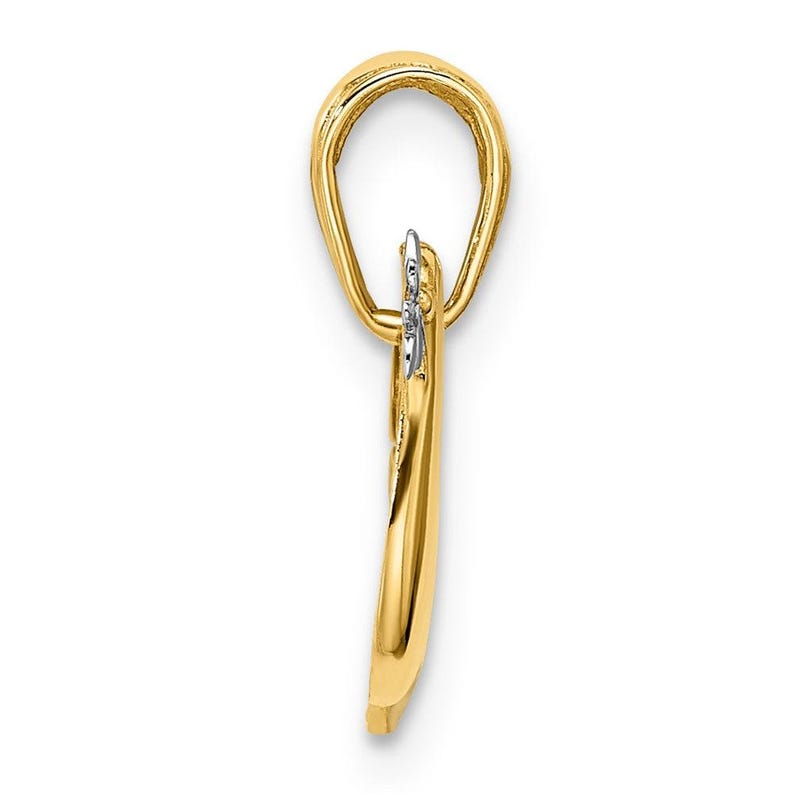 May include: A gold pendant with a heart-shaped design. The pendant has a small diamond accent.