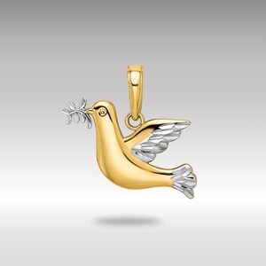 May include: A gold and silver dove pendant with an olive branch in its beak. The dove is a symbol of peace.
