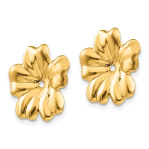 May include: A pair of gold flower-shaped earring studs. The earrings are made of 14k gold and have a smooth, polished finish.