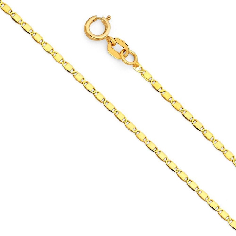 May include: A gold chain necklace with a mariner link design. The chain is approximately 18 inches long and has a lobster claw clasp.