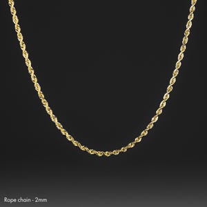 May include: A gold rope chain necklace with a 2 mm width.