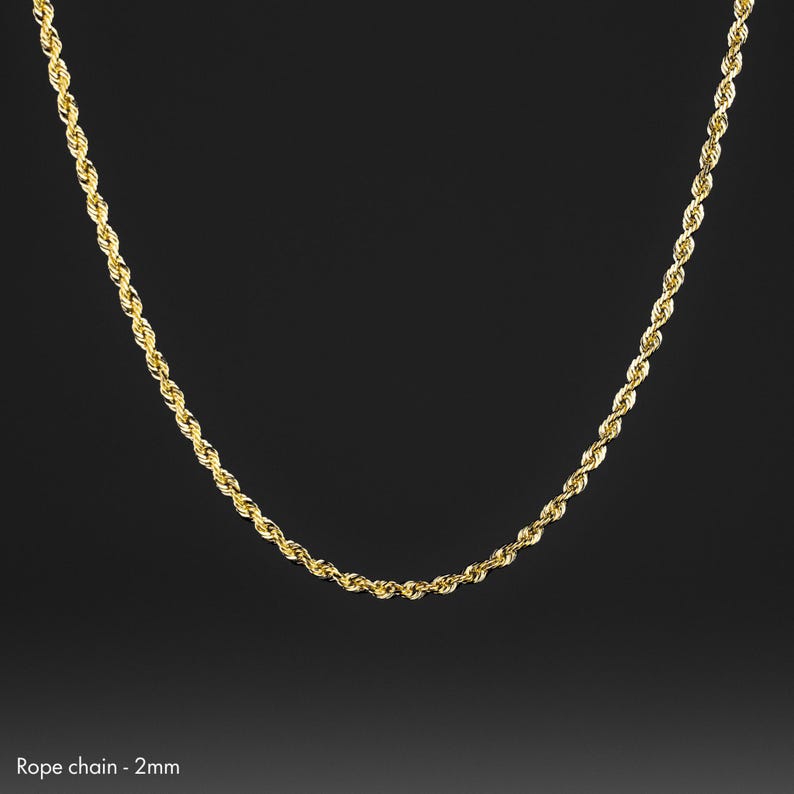 May include: A gold rope chain necklace with a 2 mm width.