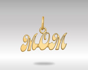 May include: A gold-colored pendant in the shape of the word "MOM" in a cursive script. The pendant has a loop at the top for attaching to a chain. The design is simple and elegant, suitable for a necklace.