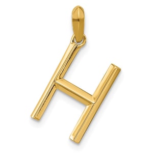 Puede incluir: Un colgante dorado con forma de la letra "H". El colgante está hecho de metal brillante y pulido, con un diseño simple y elegante. Se suspende de un pequeño lazo en la parte superior.