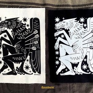 May include: Two square patches, one black and one white, each with a stylized illustration. The design shows a wolf-like creature with angel wings, pierced by arrows, and stars. The text "houndsaint" is at the bottom of each patch.
