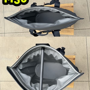 Puede incluir: Una bolsa de enfriador gris con cremallera, asa y correas negras. La bolsa est&aacute; abierta y el interior est&aacute; forrado con un material gris. La bolsa est&aacute; sobre una superficie de madera.