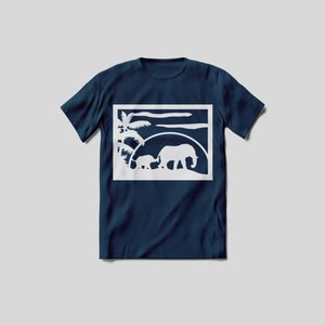 May include: A navy blue t-shirt featuring a white silhouette of two elephants walking in front of a palm tree and a sunset. The image is framed in a white square.