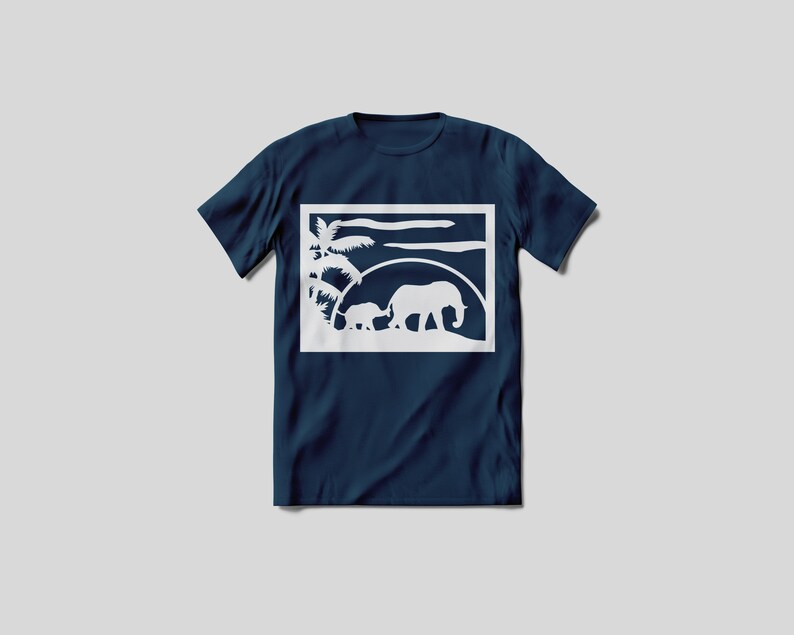 May include: A navy blue t-shirt featuring a white silhouette of two elephants walking in front of a palm tree and a sunset. The image is framed in a white square.