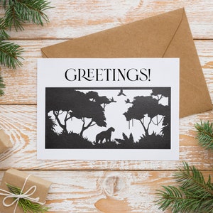 May include: A white card with the word "GREETINGS!" printed in black at the top. The card features a black silhouette of a jungle scene with trees, vines, and a leopard.