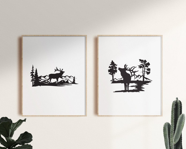 May include: Two black and white silhouette prints of an elk in a forest setting. The elk in the left print is walking, while the elk in the right print is standing with its head raised. Both prints feature a mountain range in the background.