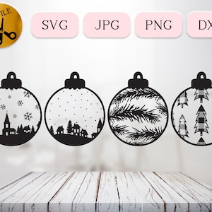 May include: Four black and white Christmas ornament designs. The ornaments feature a snowy village, a pine branch, a plaid pattern, and a snowflake pattern.
