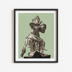 May include: A sepia-toned photograph of a stone statue of a Balinese deity playing a musical instrument. The statue is standing on a stone base and is set against a green background.