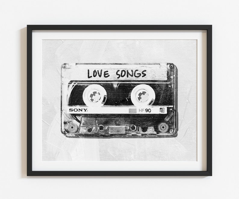 May include: Black and white image of a vintage cassette tape with the words "LOVE SONGS" written on the label. The cassette tape is a Sony brand and is labeled "HF 90".